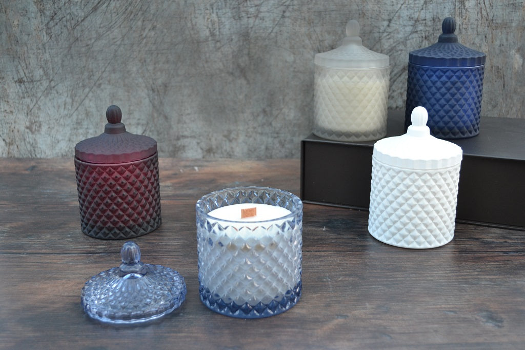 Hand crafted geo glass candles boast a unique geometric form and feature classically-styled French round top lids