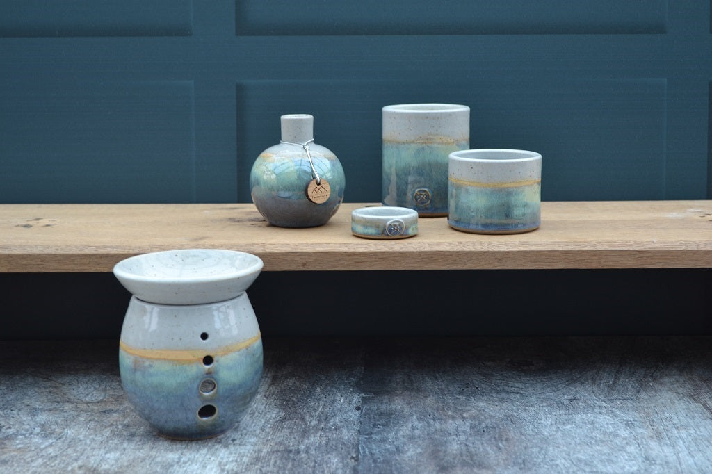 A stoneware collection in a Sea Green glaze of candles, burners, diffusers and tealights all of which have been thrown by hand in the Cambrian Mountains of Mid Wales