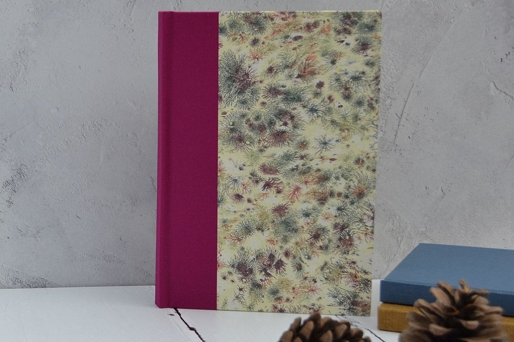 Hand marbled paper in hand bound books