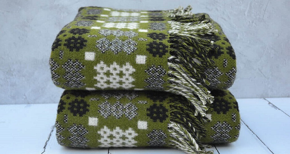welsh blankets in moss green and in the caernarfon portcullis pattern