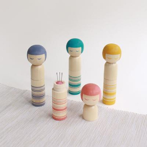 Cohana - Kokeshi Doll Pin Cushion - Designed as the traditional shape and bobbed hair of the kokeshi. The doll's base is magnetic to easily pick up fallen pins and needles. Each doll opens to reveal a pincushion and comes with three quality needles
