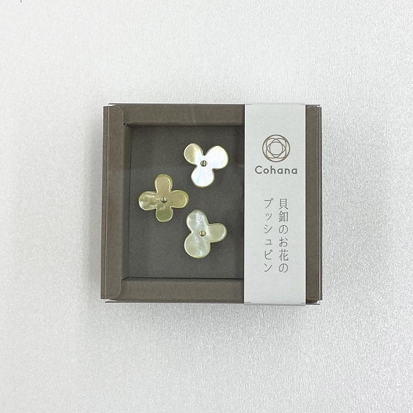 Cohana - Flower Push Pins - Mother-of-pearl pins in a flower motif are cut from oyster shells. Finished with delicate golden pins made in Hiroshima, known for producing fine needles.  Use them on your cork board - they look like little flowers blooming