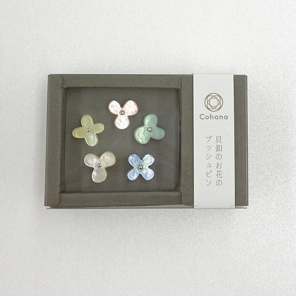 Cohana - Flower Push Pins - Mother-of-pearl pins in a flower motif are cut from oyster shells. Finished with delicate golden pins made in Hiroshima, known for producing fine needles.  Use them on your cork board and they look like little flowers blooming